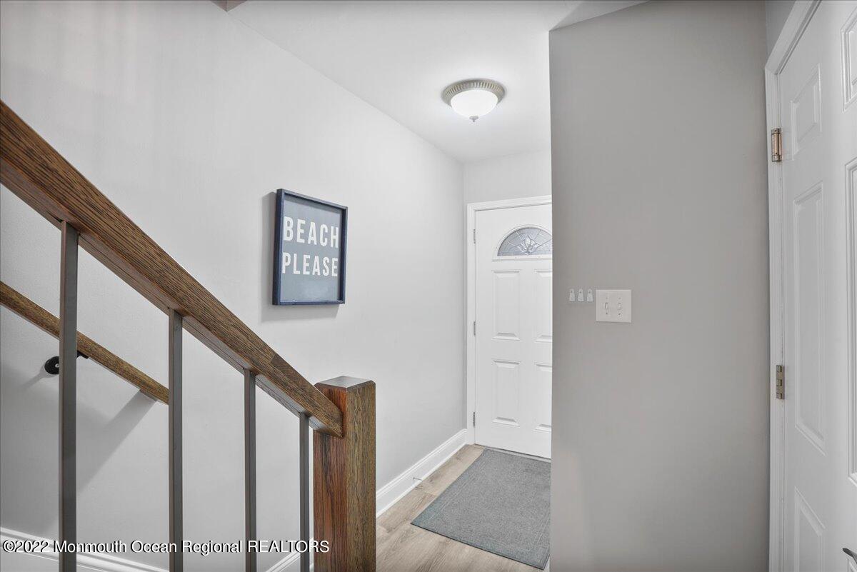 5 Island View Way, Unit 10 Sea Bright, NJ 07760 - Photo 7 of 30 a view of entryway with wooden floor and stairs