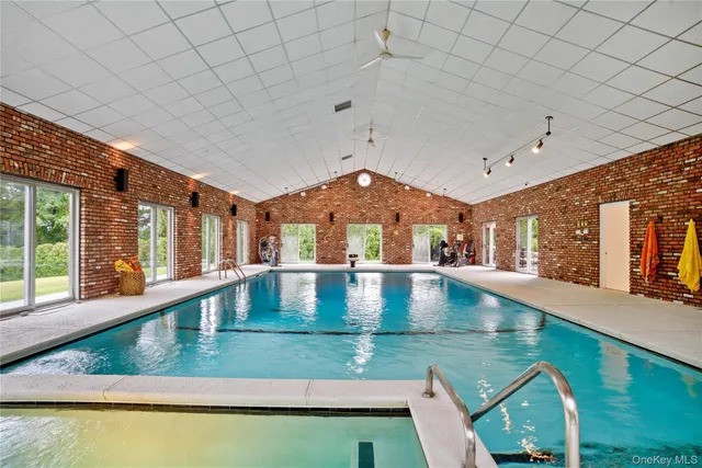 a living room with lots of furniture and a table