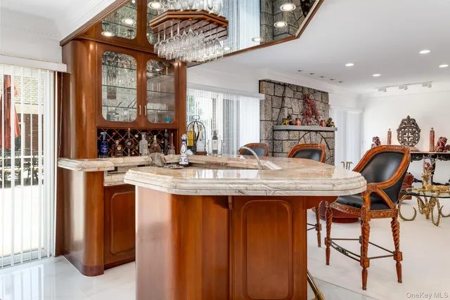 a kitchen with a sink and white cabinets