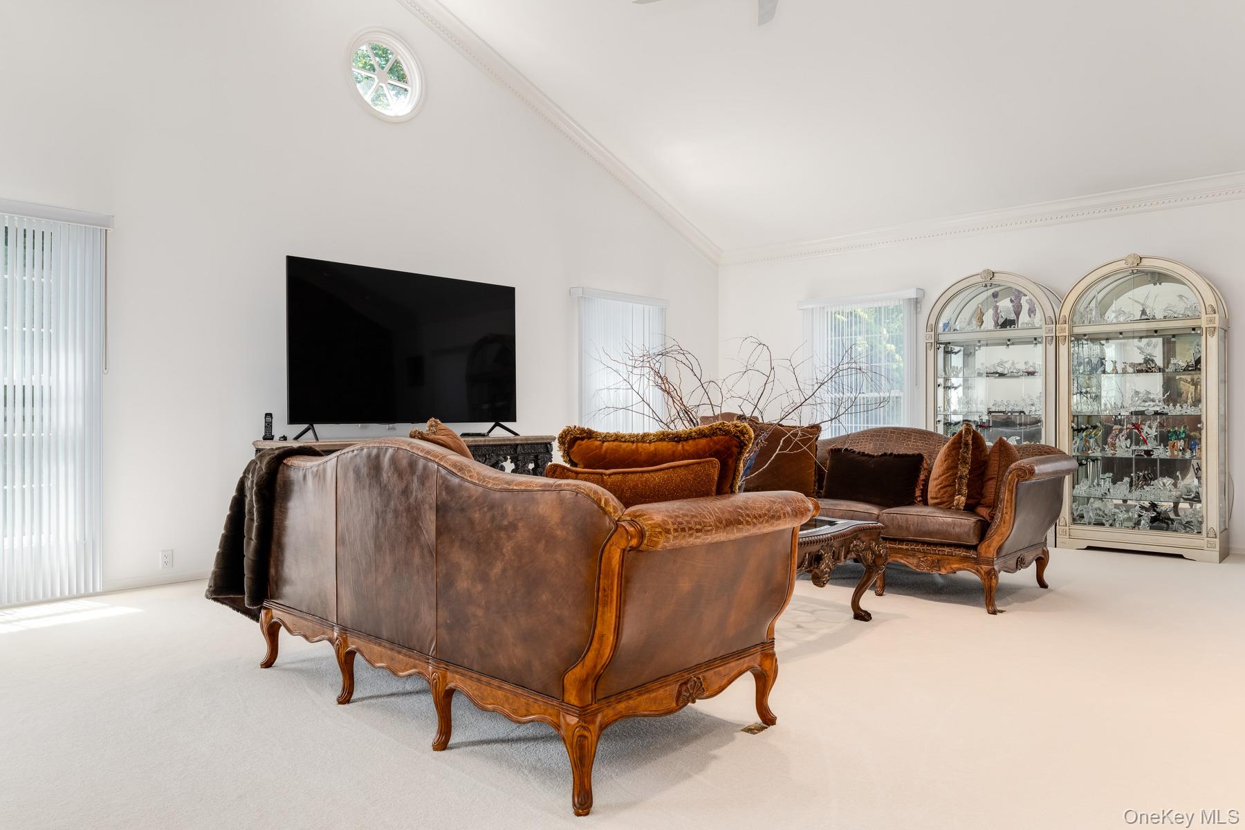 109 Mamaroneck Road Scarsdale, NY 10583 - Photo 36 of 50 Spacious Media room with high vaulted ceiling and Greek dentil crown molding, hardwood flooring under carpet