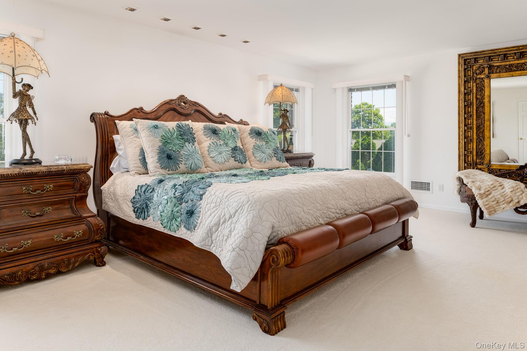 109 Mamaroneck Road Scarsdale, NY 10583 - Photo 40 of 50 Primary bedroom with hardwood floors under carpet, recessed lighting on dimmers, walk-in closet, large windows