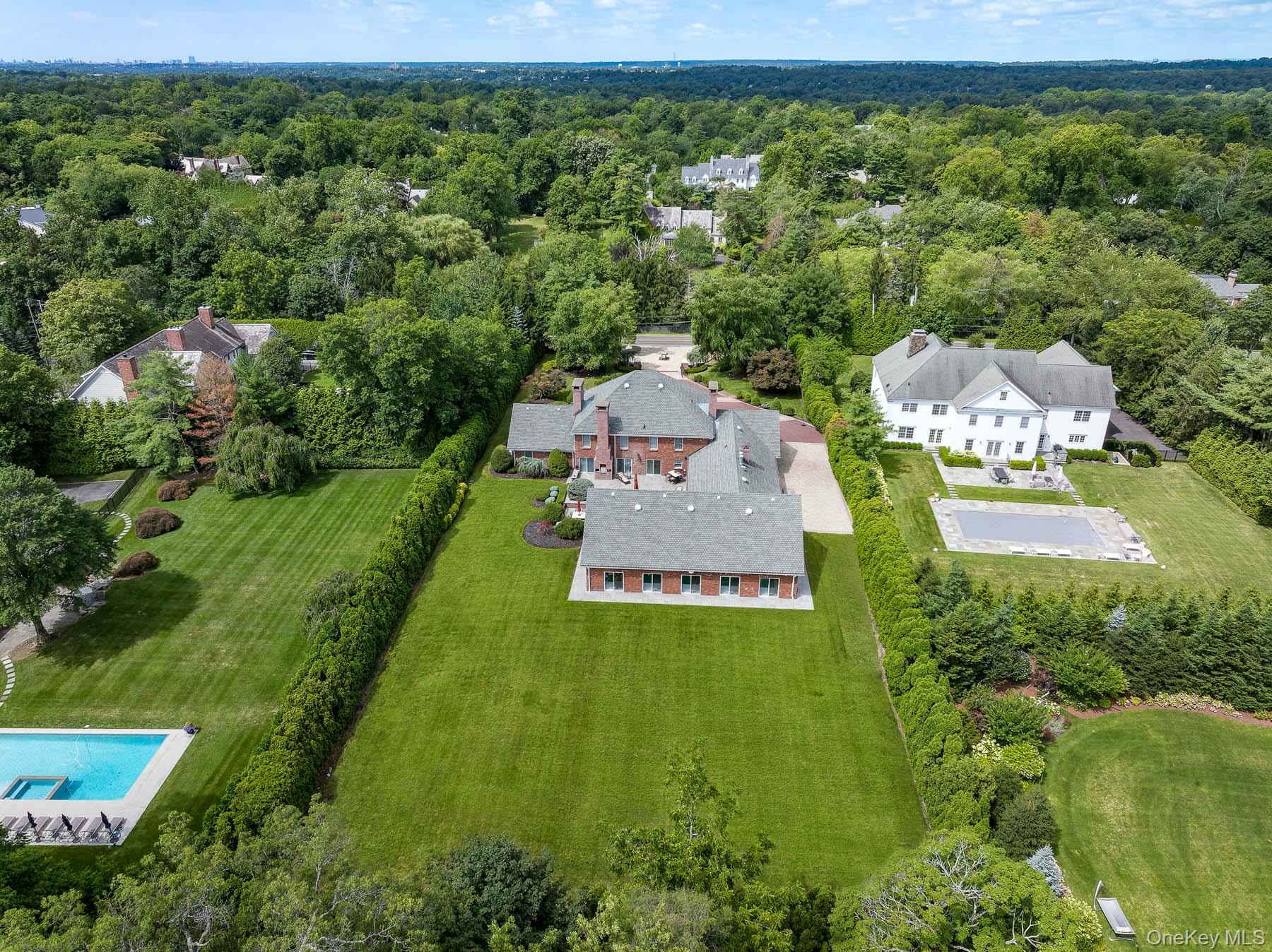 109 Mamaroneck Road Scarsdale, NY 10583 - Photo 6 of 50 Back view of property with plenty of room for a playground area, putting green, outdoor pool, tennis court, basketball court.