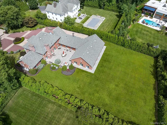 an outdoor view of a house with swimming pool