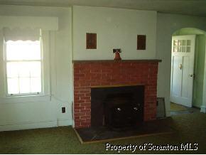 87 Rr 4 Altoona, PA 16601 - Photo 3 of 4 a living room with a fireplace
