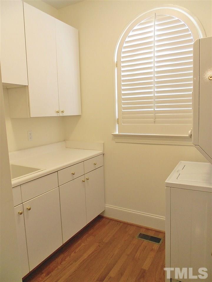 2300 Elmsford Way Raleigh, NC 27608 - Photo 19 of 30 ...has deep sink, terrific cabinet storage, and a stack washer/dryer
