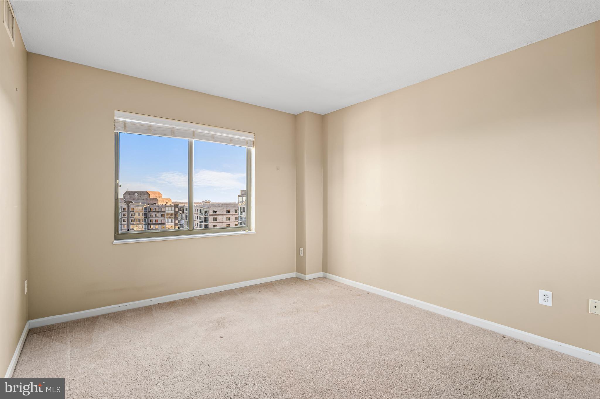 19365 Cypress Ridge Terrace, Unit 1115 Leesburg, VA 20176 - Photo 13 of 34 an empty room with a window
