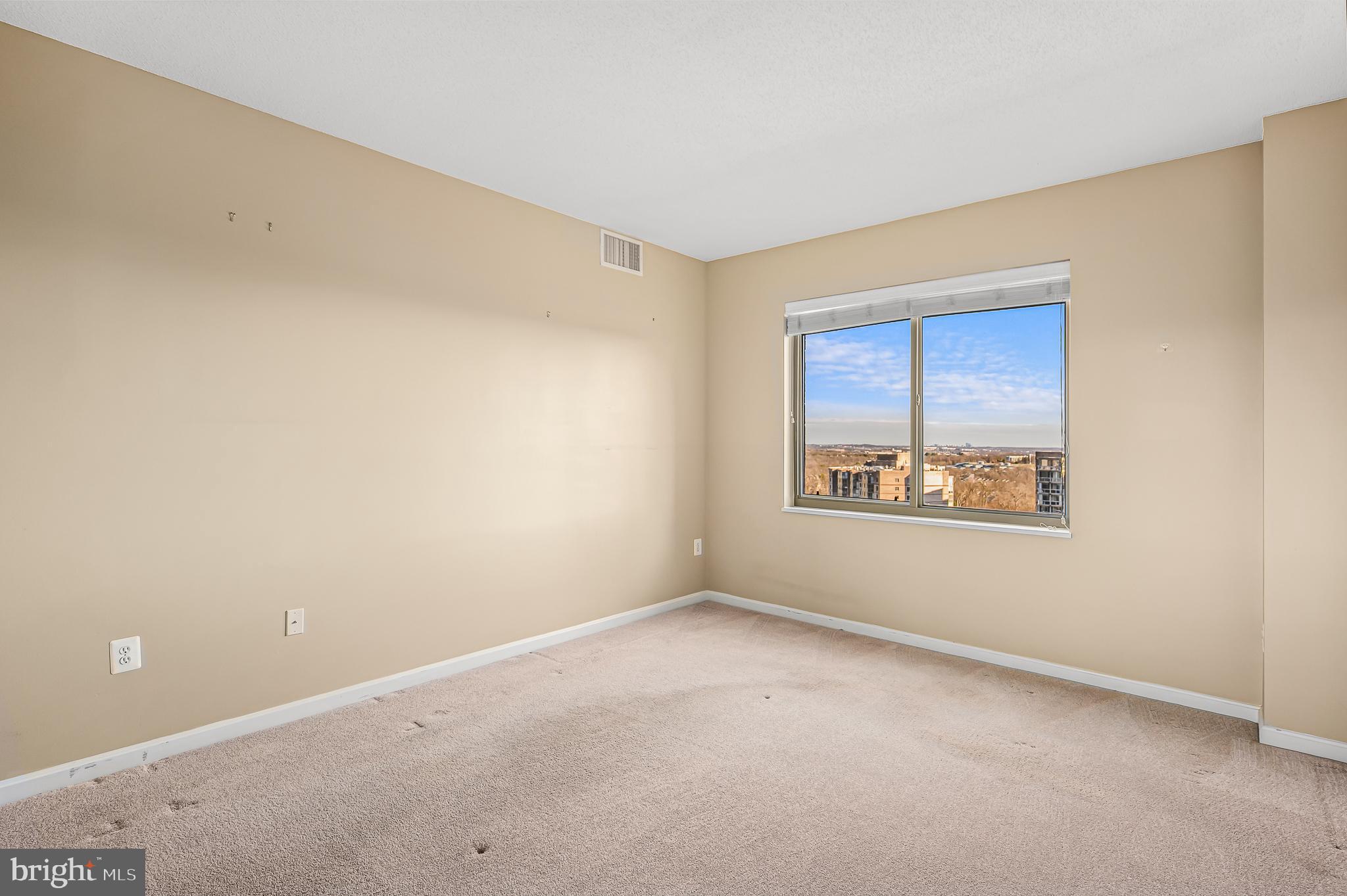 19365 Cypress Ridge Terrace, Unit 1115 Leesburg, VA 20176 - Photo 14 of 34 an empty room with windows