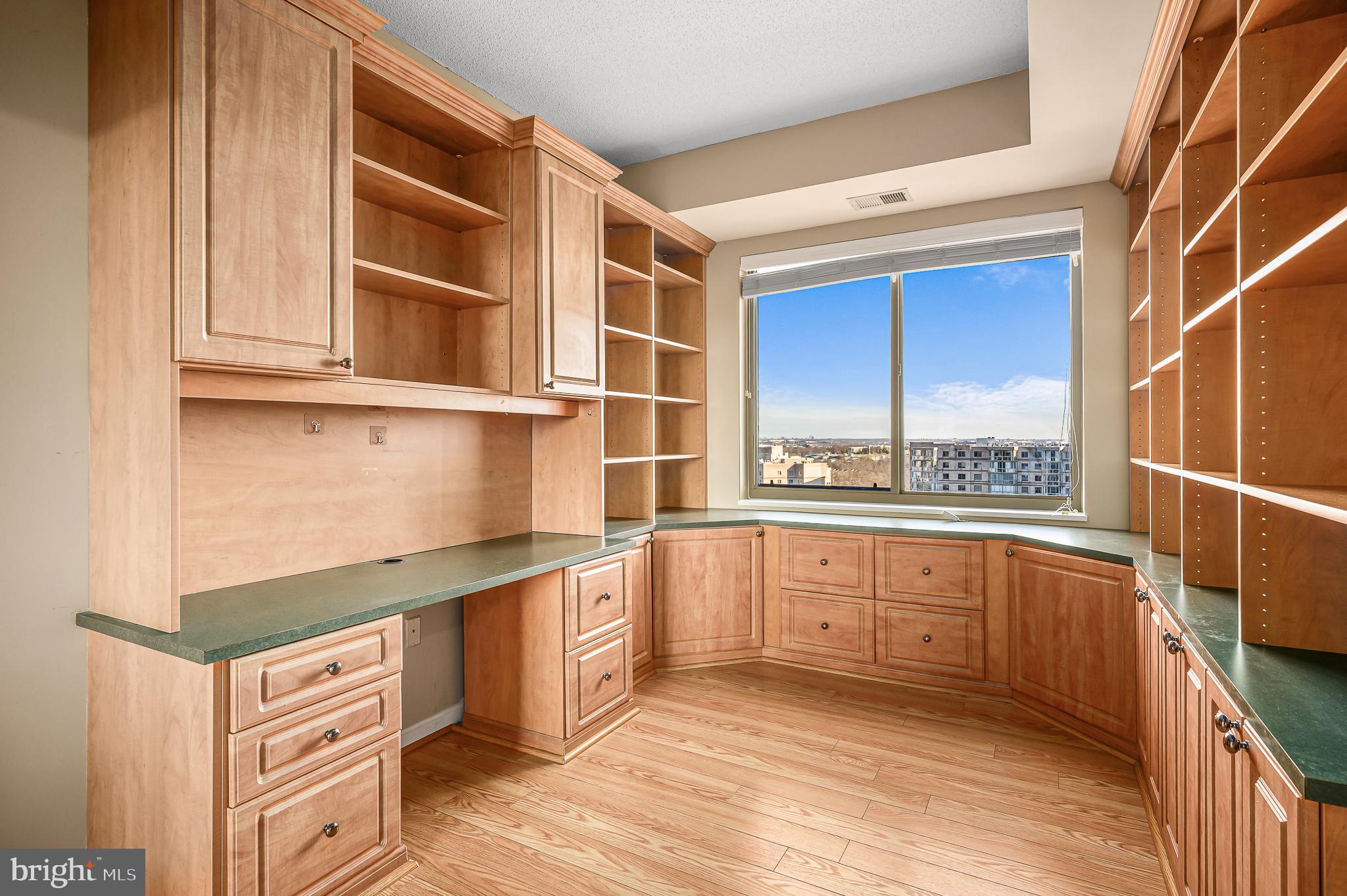 19365 Cypress Ridge Terrace, Unit 1115 Leesburg, VA 20176 - Photo 18 of 34 a kitchen with stainless steel appliances granite countertop a stove and a sink