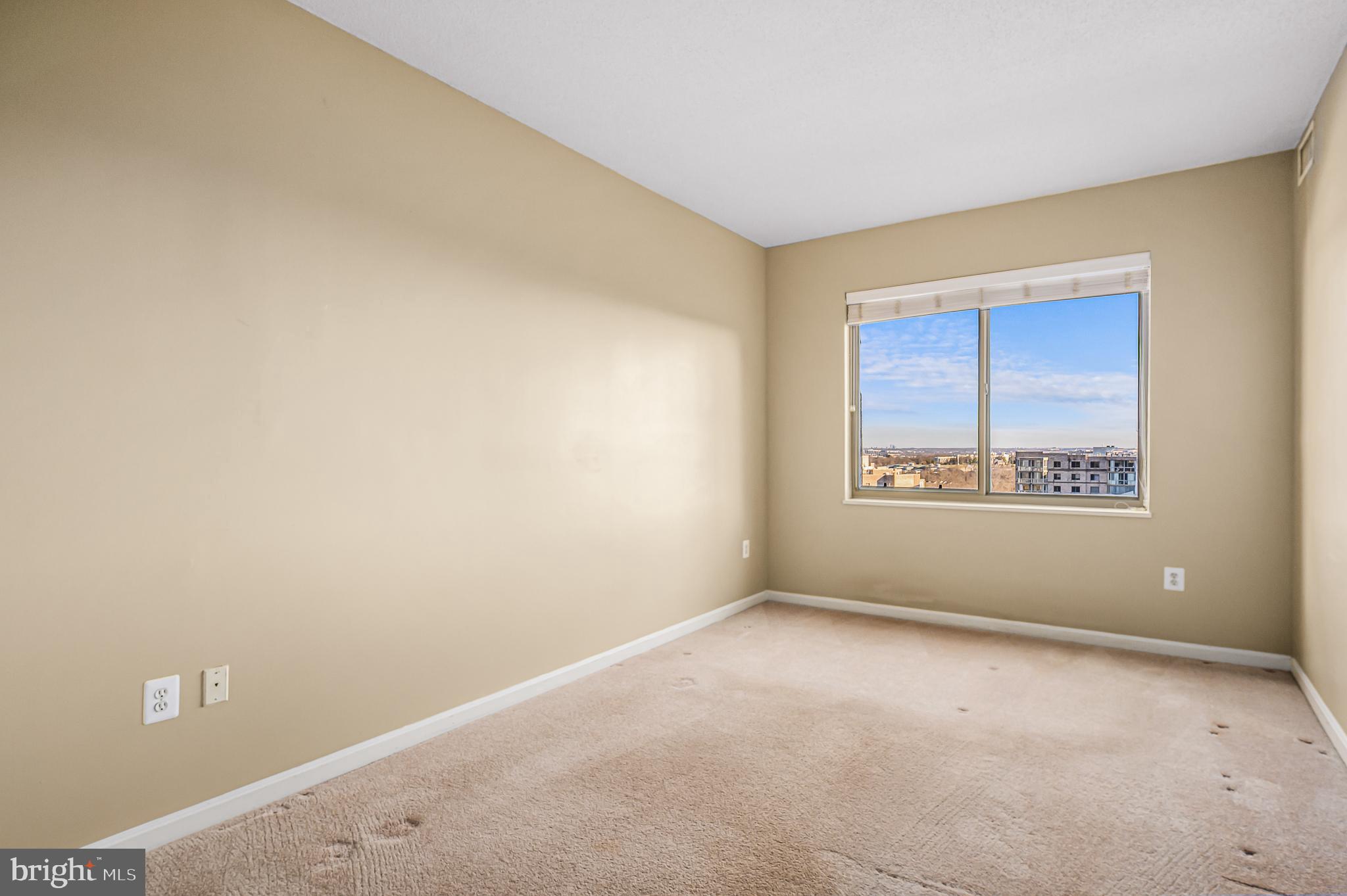 19365 Cypress Ridge Terrace, Unit 1115 Leesburg, VA 20176 - Photo 21 of 34 a view of an empty room with a window