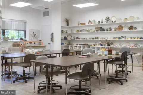 a view of a dining room with furniture and window