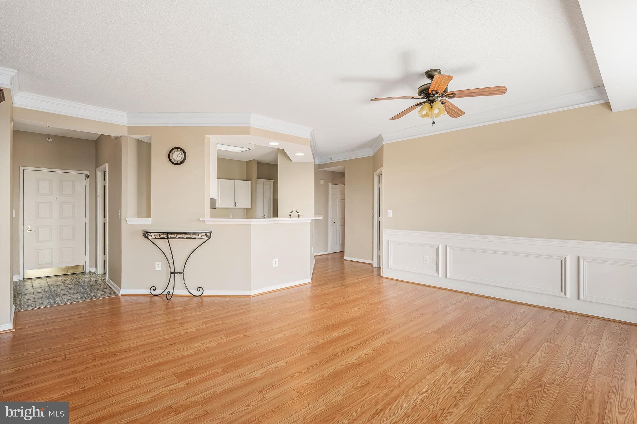 19365 Cypress Ridge Terrace, Unit 1115 Leesburg, VA 20176 - Photo 4 of 34 a view of a room with wooden floor and cabinet
