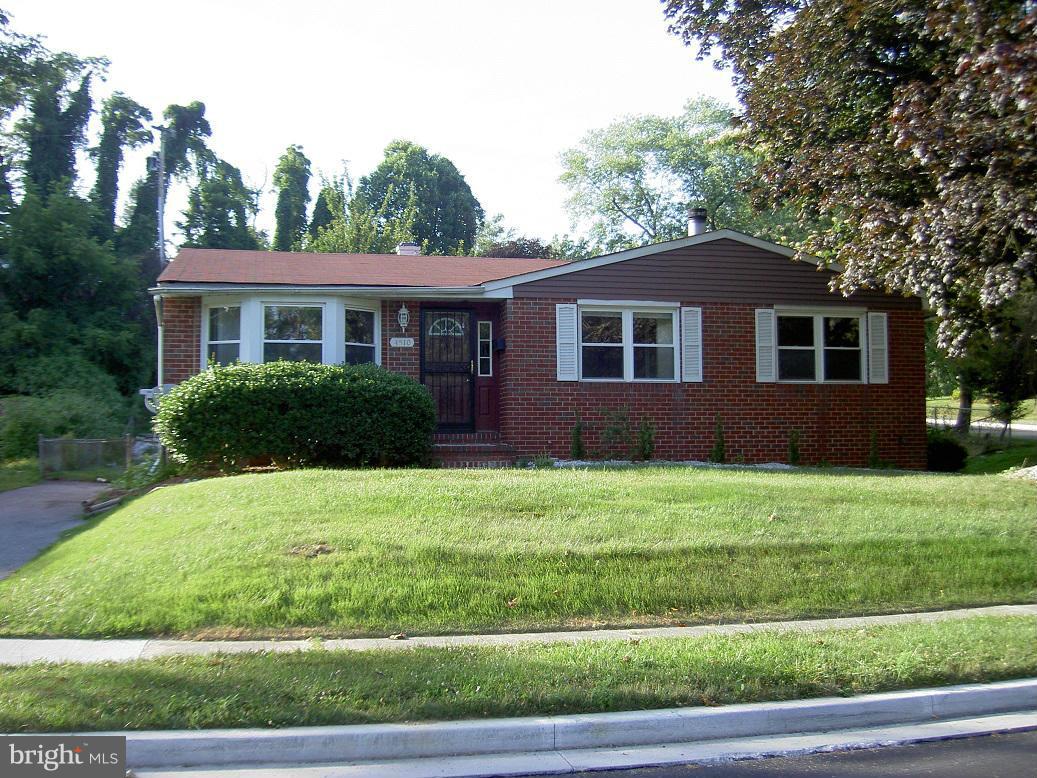 4510 Maryknoll Road Baltimore, MD 21208 - Photo 1 of 30 a front view of a house with a yard