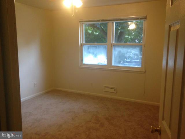 4510 Maryknoll Road Baltimore, MD 21208 - Photo 16 of 30 an empty room with a window