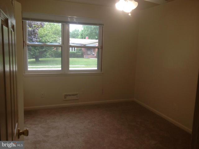 4510 Maryknoll Road Baltimore, MD 21208 - Photo 17 of 30 an empty room with a window