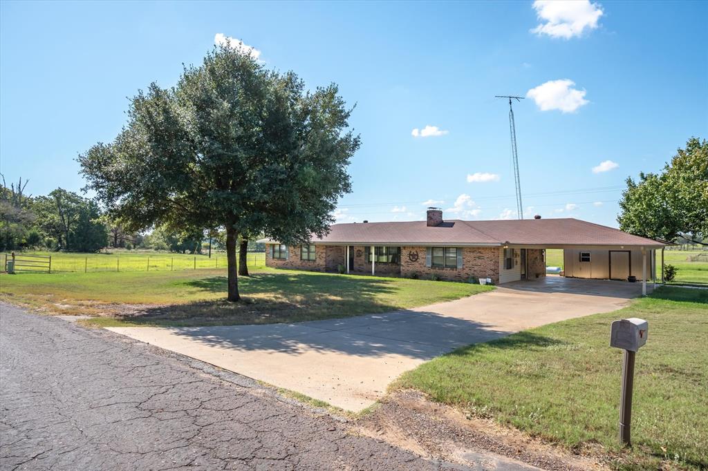 3121 County Road 1215 Canton, TX 75103 - Photo 1 of 40 a view of a house with swimming pool and yard