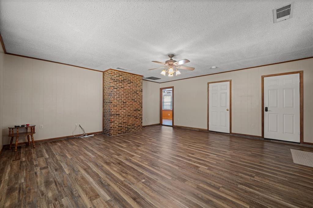 3121 County Road 1215 Canton, TX 75103 - Photo 11 of 40 wooden floor in an empty room with a window