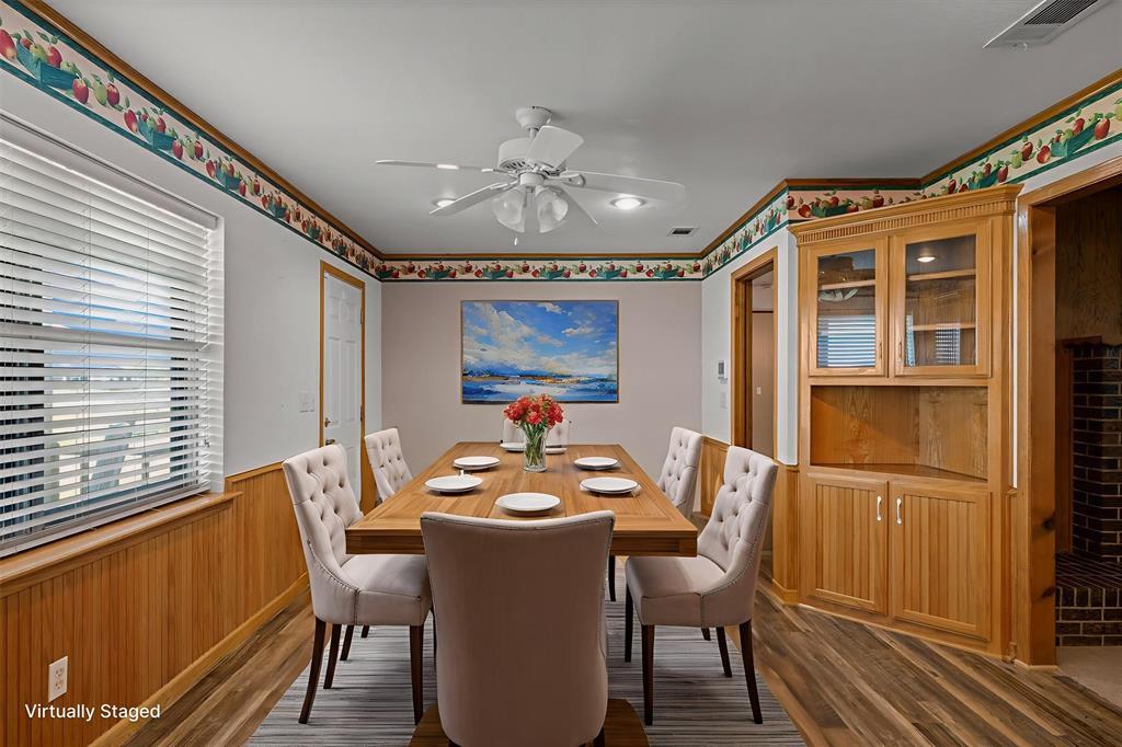 3121 County Road 1215 Canton, TX 75103 - Photo 13 of 40 a dining room with furniture a chandelier and wooden floor