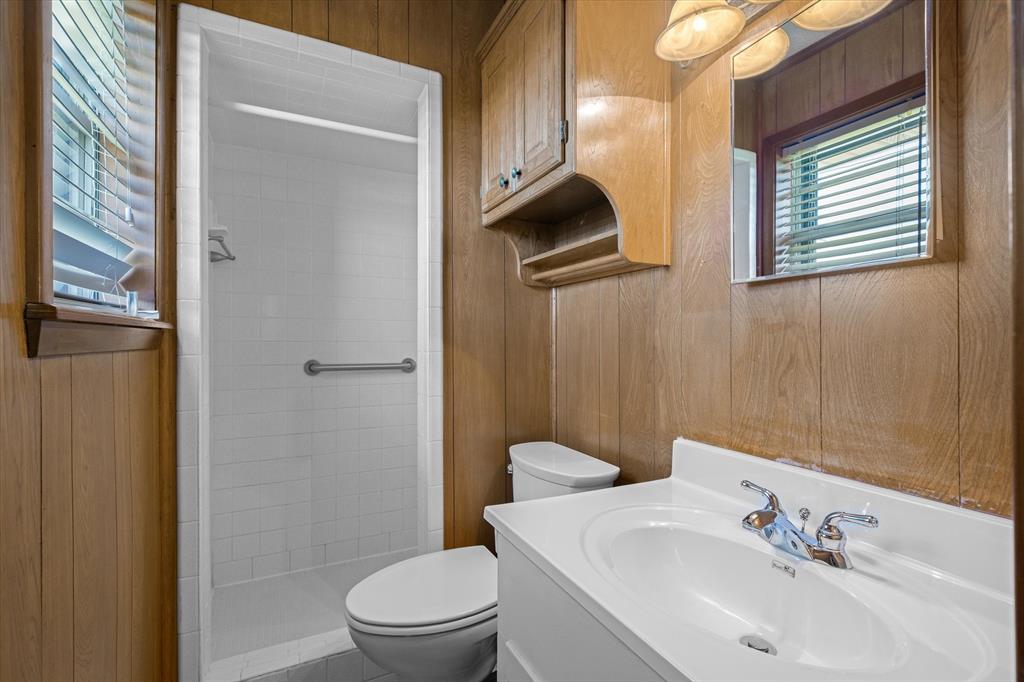 3121 County Road 1215 Canton, TX 75103 - Photo 22 of 40 a bathroom with a sink toilet and shower