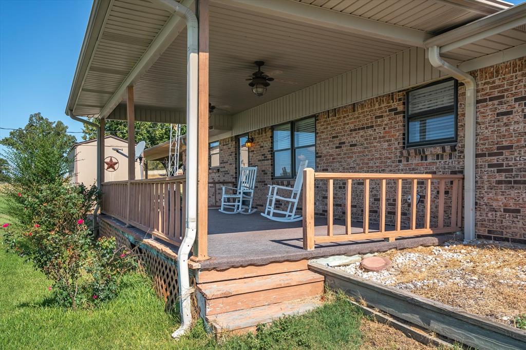 3121 County Road 1215 Canton, TX 75103 - Photo 31 of 40 a view of a house with a large window and wooden fence
