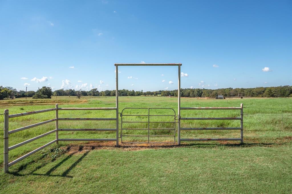 3121 County Road 1215 Canton, TX 75103 - Photo 33 of 40 a view of a yard with an empty space and wooden fence