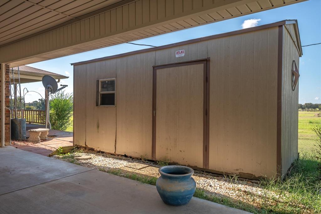 3121 County Road 1215 Canton, TX 75103 - Photo 34 of 40 a view of a door and chair in front of a door