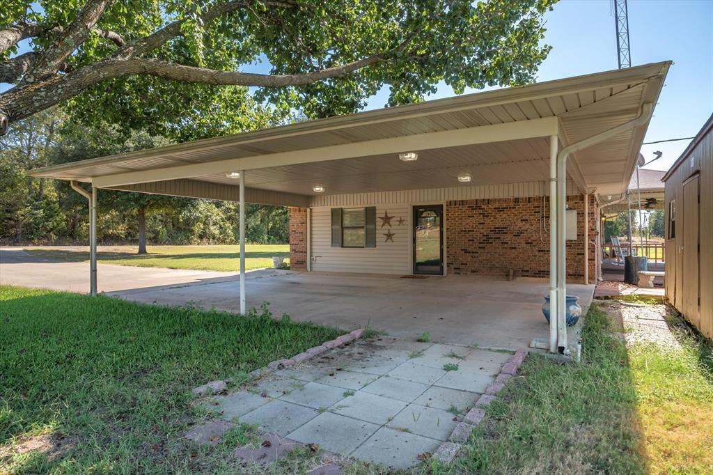 3121 County Road 1215 Canton, TX 75103 - Photo 35 of 40 a view of a swimming pool with a porch