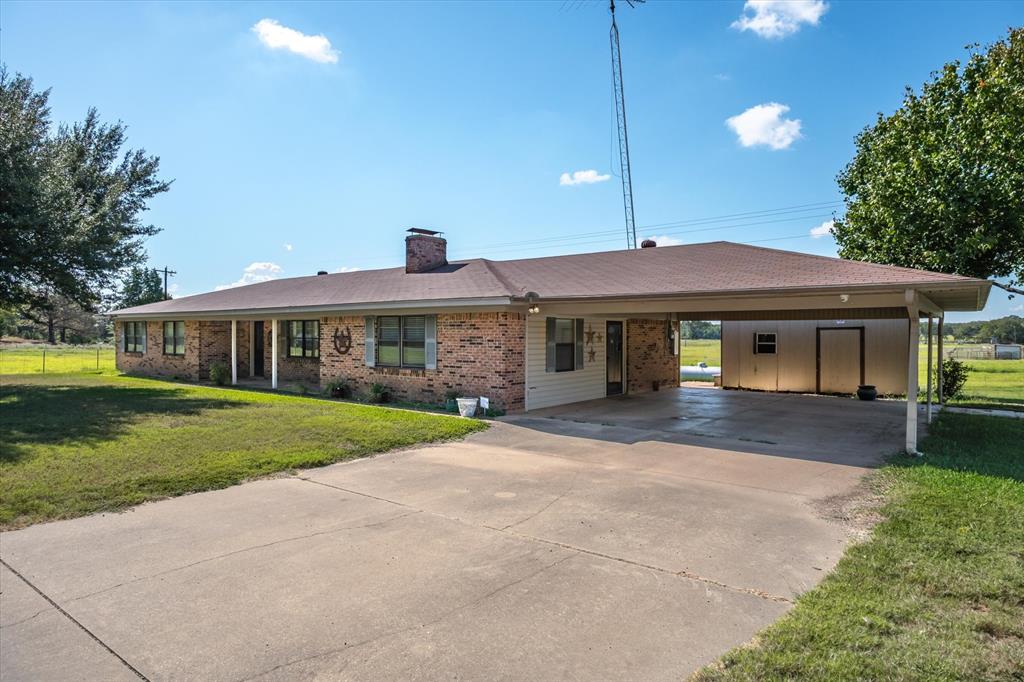 3121 County Road 1215 Canton, TX 75103 - Photo 36 of 40 a front view of a house with a yard and porch