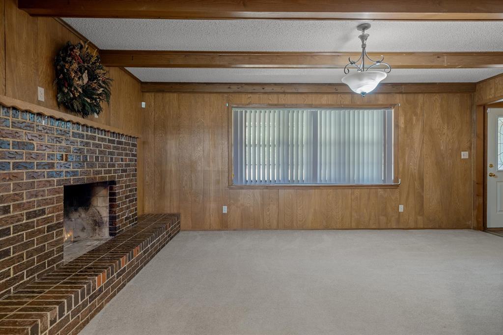 3121 County Road 1215 Canton, TX 75103 - Photo 7 of 40 a view of an empty room with a fireplace