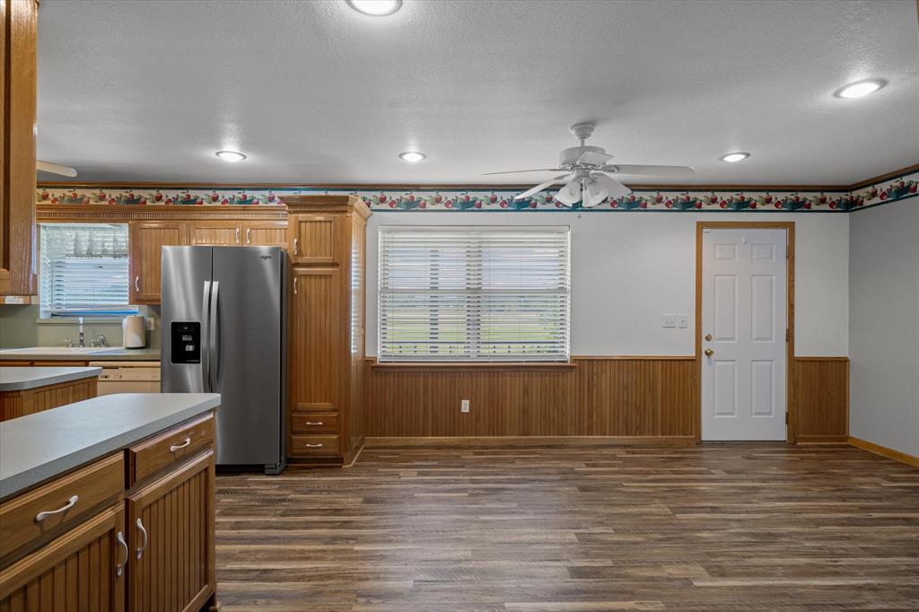 3121 County Road 1215 Canton, TX 75103 - Photo 8 of 40 a view of a kitchen with a sink and a refrigerator