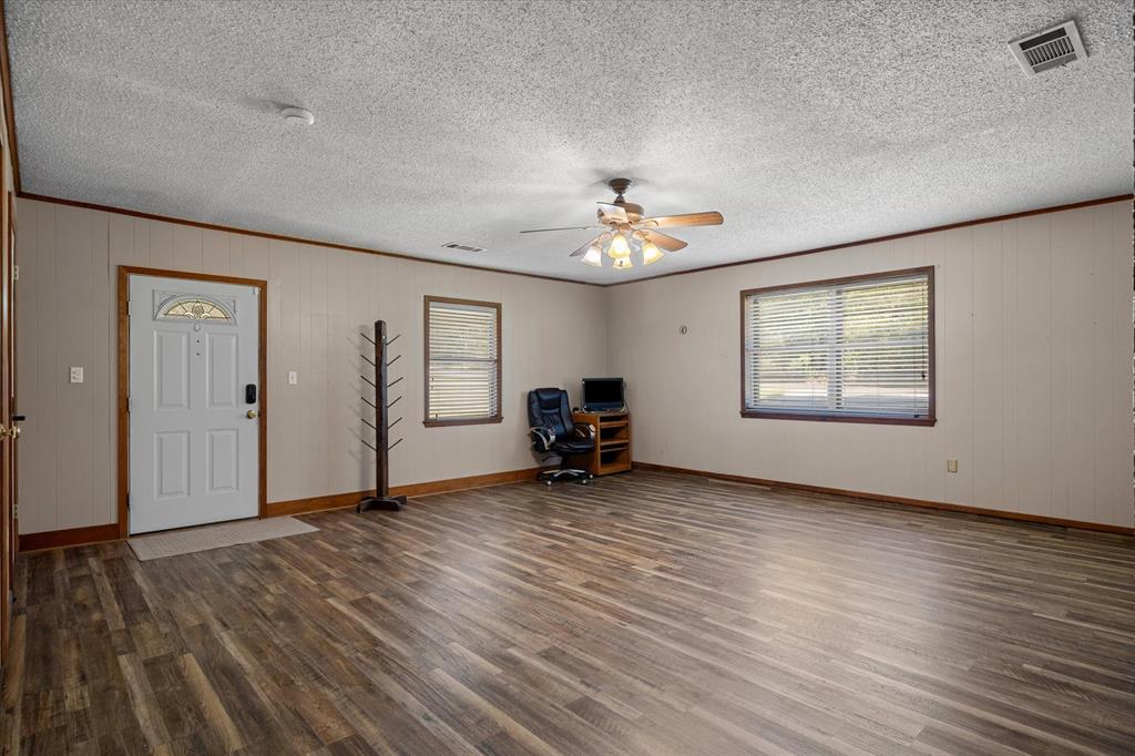 3121 County Road 1215 Canton, TX 75103 - Photo 9 of 40 a view of livingroom with hardwood floor and workspace