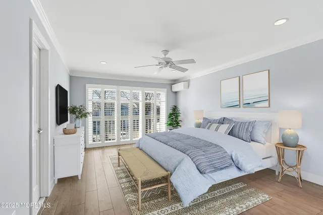 a bedroom with a large bed and a large window