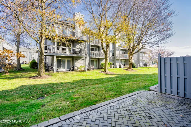 a view of a building with a yard