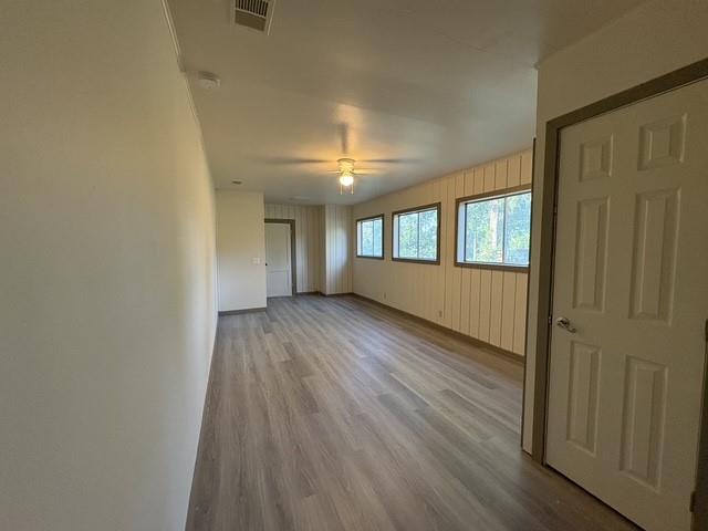 4876 East Williams Spring Road Fort Worth, TX 76135 - Photo 8 of 20 a view of wooden floor and windows in an empty room