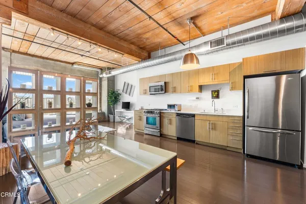 a large kitchen with a large window