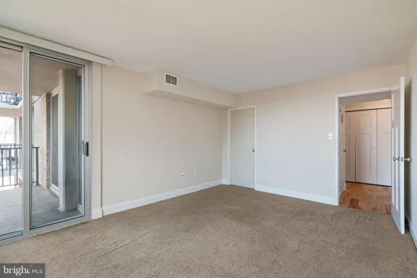a view of an empty walk in closet