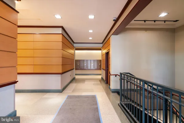 a lobby with furniture and floor to ceiling window