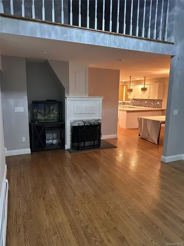 a view of a livingroom with a fireplace and a fireplace