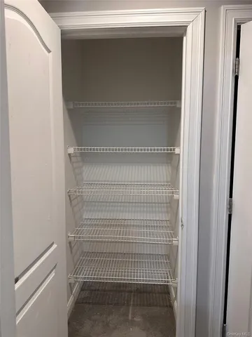 a view of hallway with wooden floor