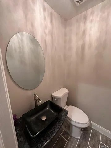 a bathroom with a sink and a toilet