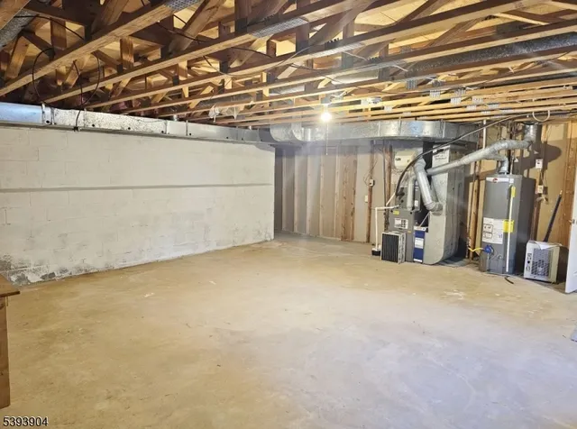 a view of a yard with wooden fence