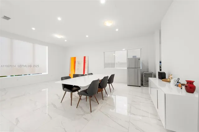 a kitchen with stainless steel appliances granite countertop a sink and a stove