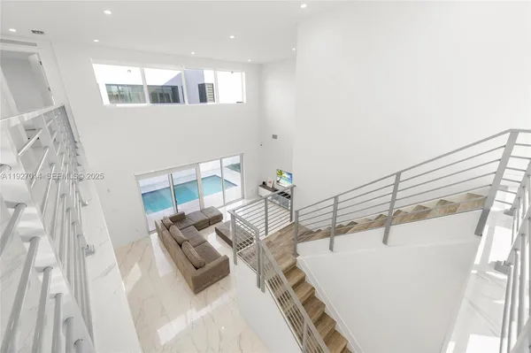 a bathroom with a tub a sink and a large mirror