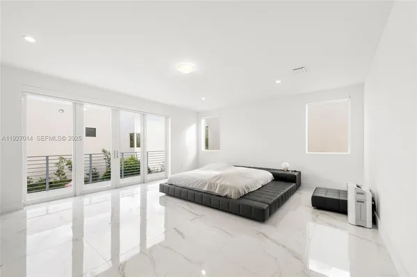 a kitchen with stainless steel appliances granite countertop a sink and a stove