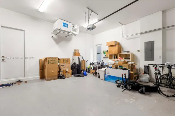 a outdoor space with lots of tables a couches and kitchen view