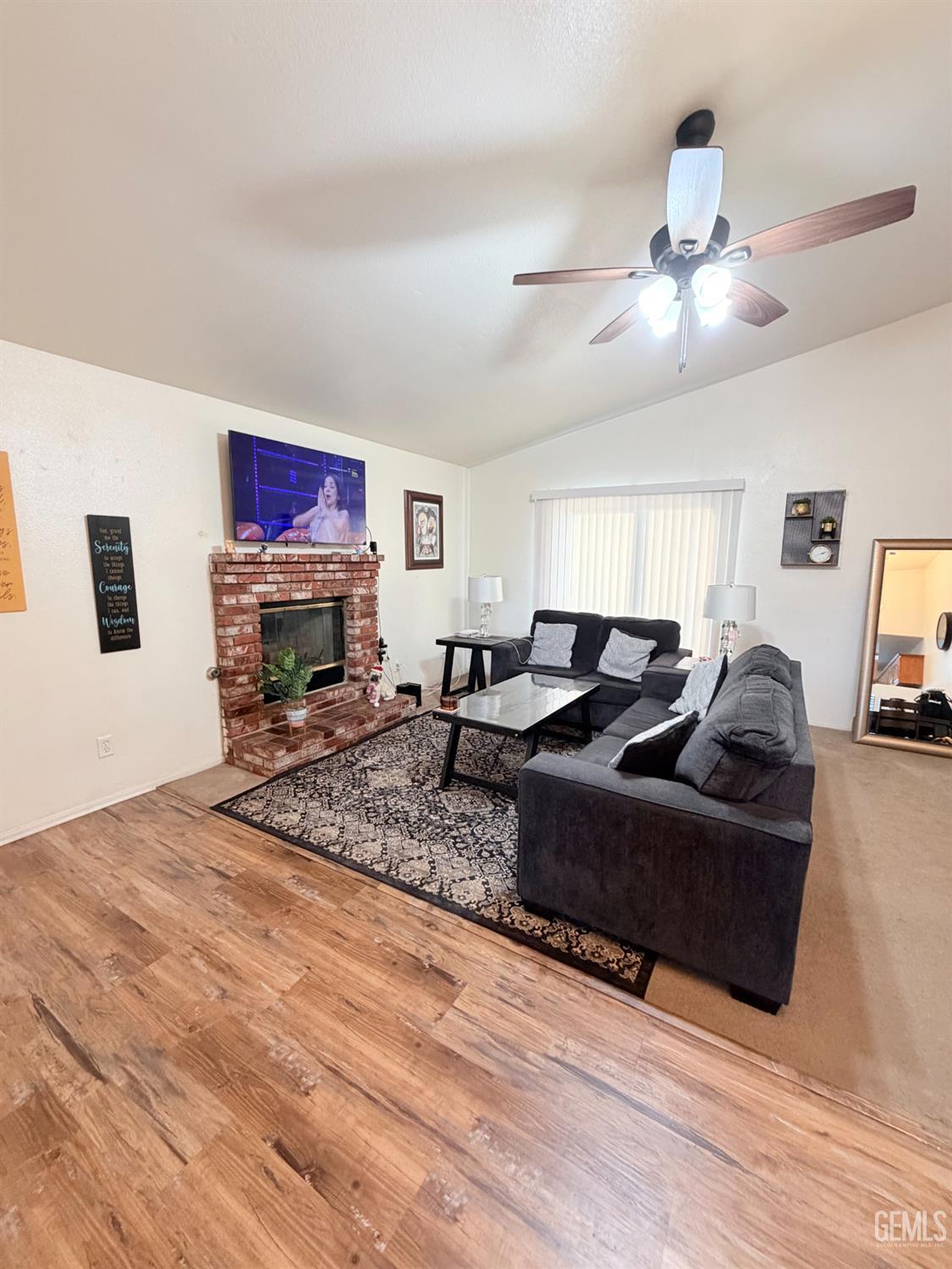 Undisclosed Address Bakersfield, CA 93313 - Photo 6 of 18 a living room with furniture and a flat screen tv