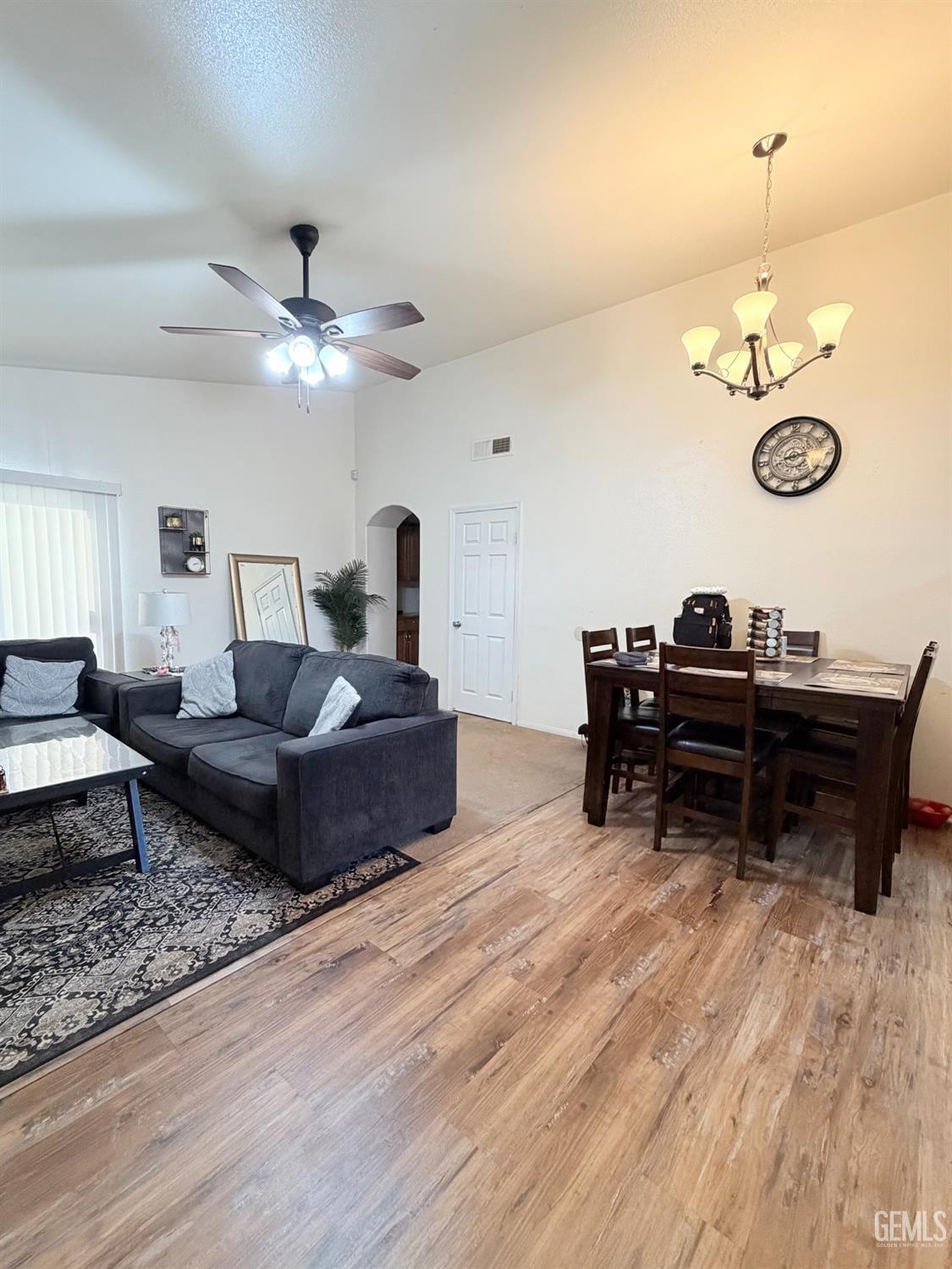 Undisclosed Address Bakersfield, CA 93313 - Photo 7 of 18 a living room with furniture and a wooden floor