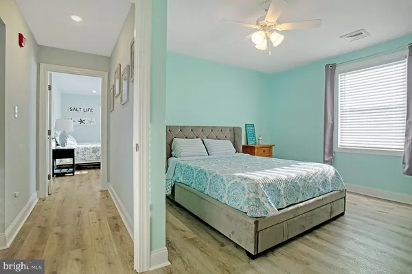 a bedroom with a bed and a dresser