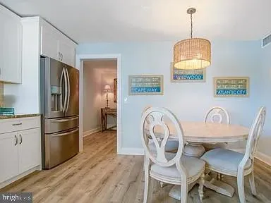 a bedroom with two beds and a dresser