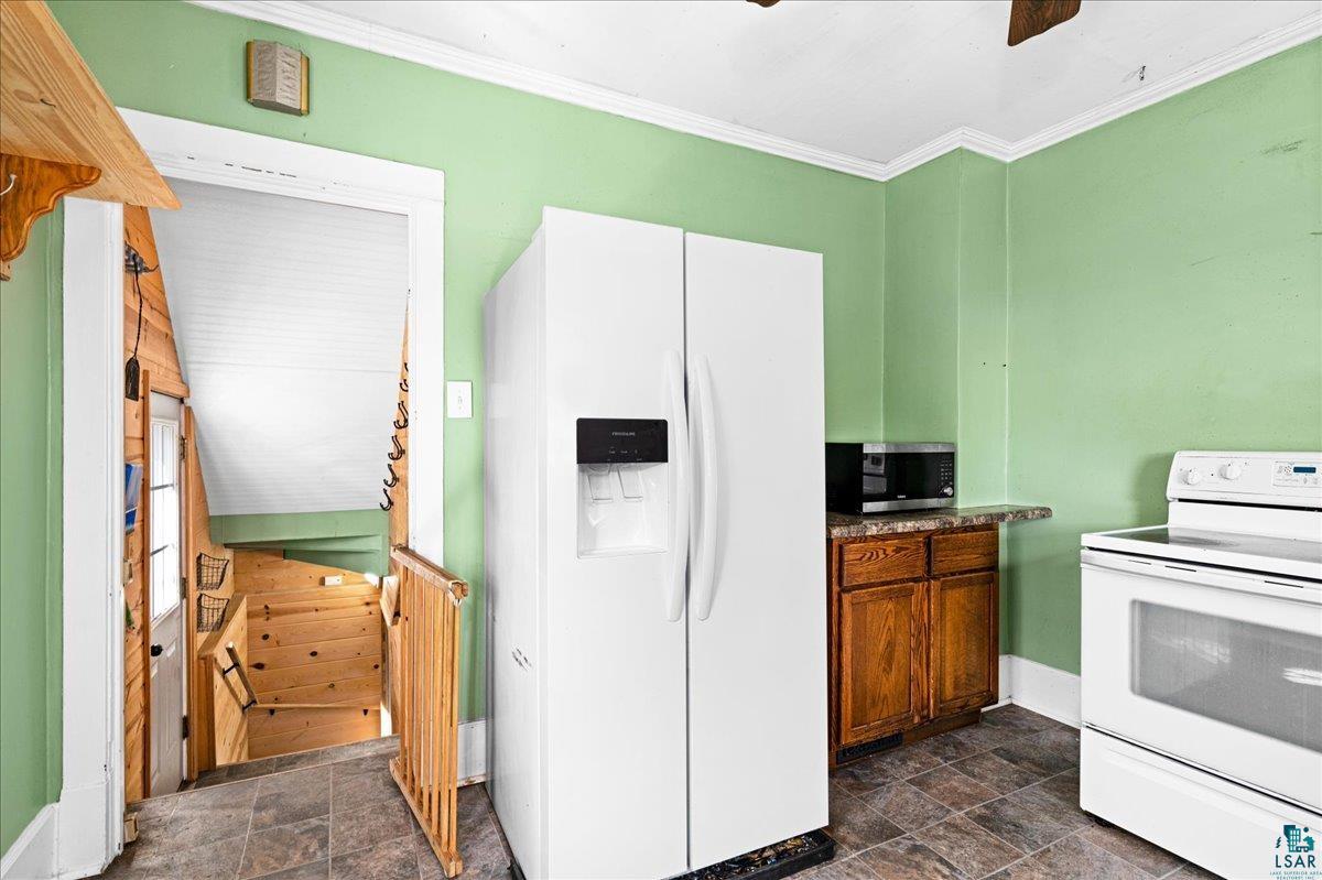 519 3rd Avenue Proctor, MN 55810 - Photo 11 of 25 Kitchen with crown molding and white appliances