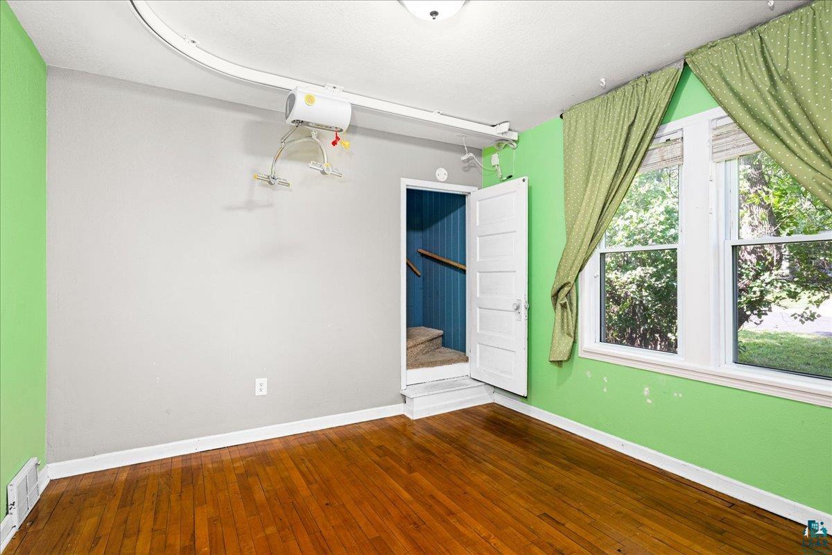 519 3rd Avenue Proctor, MN 55810 - Photo 16 of 25 Spare room featuring hardwood / wood-style floors